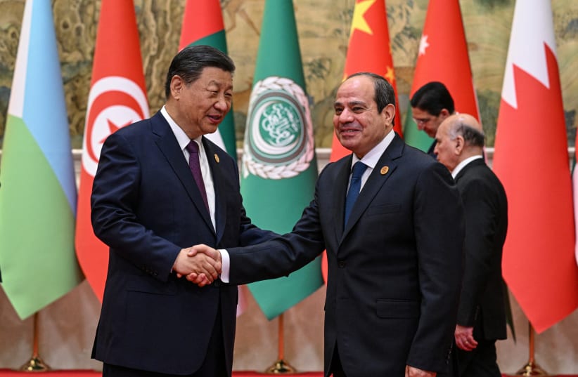  China’s President Xi Jinping shakes hands with Egypt’s President Abdel Fattah al-Sisi ahead of the opening ceremony of the 10th Ministerial Meeting of China-Arab States Cooperation Forum at the Diaoyutai State Guesthouse in Beijing, China May 30, 2024.  (photo credit: JADE GAO/Pool via REUTERS)