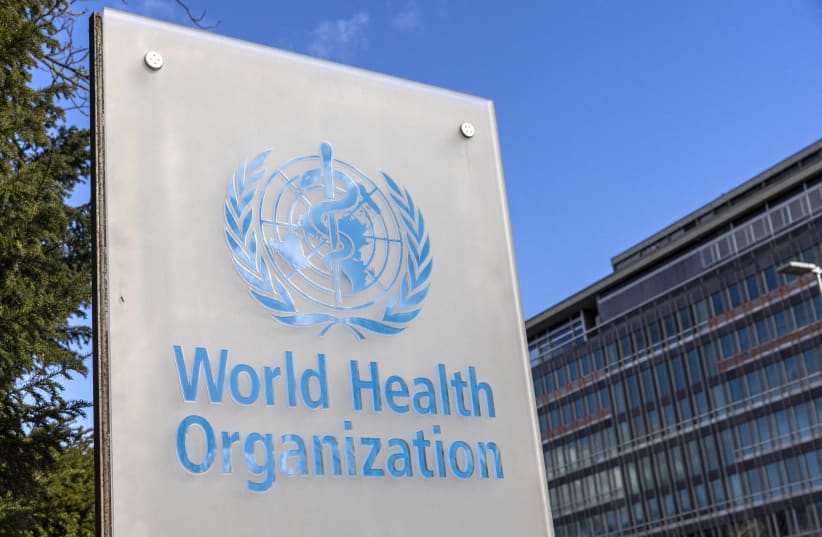 The World Health Organisation (WHO) logo is seen near its headquarters in Geneva, Switzerland, February 2, 2023. (photo credit: DENIS BALIBOUSE/REUTERS)