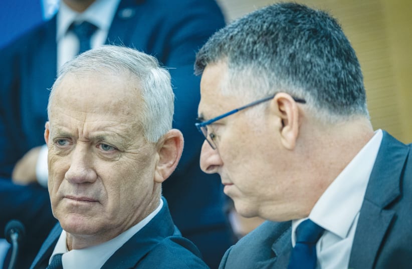  THEN-DEFENSE MINISTER Benny Gantz and then-justice minister Gideon Sa’ar confer in the Knesset, 2022. (photo credit: YONATAN SINDEL)