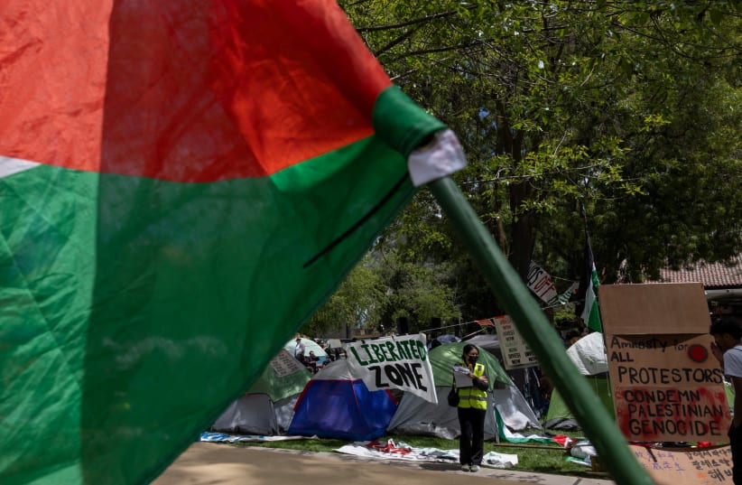  Students are seen at a protest encampment in support of Palestinians at Stanford University during the ongoing conflict between Israel and the Palestinian Islamist group Hamas, in Stanford, California U.S., April 26, 2024.  (photo credit: CARLOS BARRIA / REUTERS)