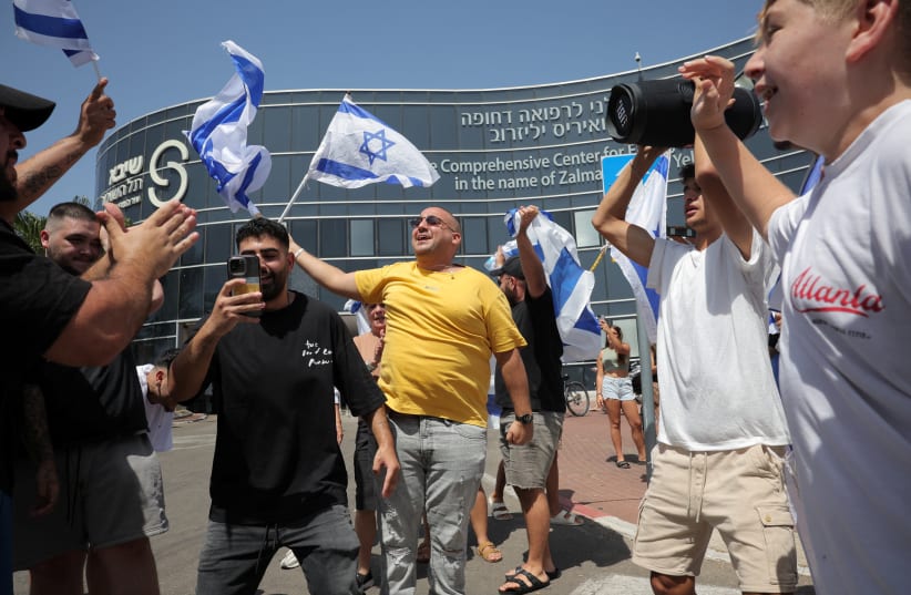 Israelis celebrate the release of four hostages in Ramat Gan on June 8, 2024 (photo credit: REUTERS/MARKO DJURICA)
