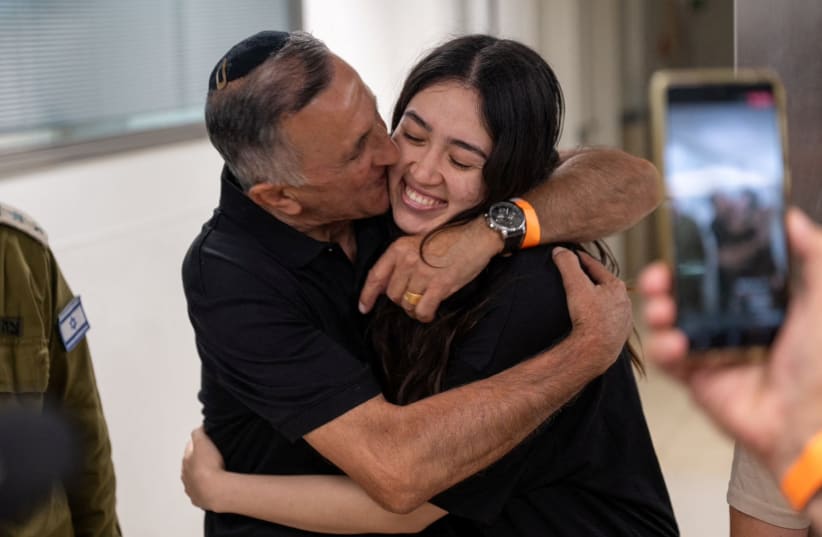  Noa Argamani, a rescued hostage embraces her father, Yakov Argamani, after the military said that Israeli forces have rescued four hostages alive from the central Gaza Strip, in Ramat Gan, Israel, in this handout image obtained by Reuters on June 8, 2024. (photo credit: VIA REUTERS)