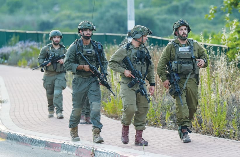  SECURITY FORCES are on the scene in the Druze village of Hurfeish in the Upper Galilee after a drone attack. (photo credit: AYAL MARGOLIN/FLASH90)
