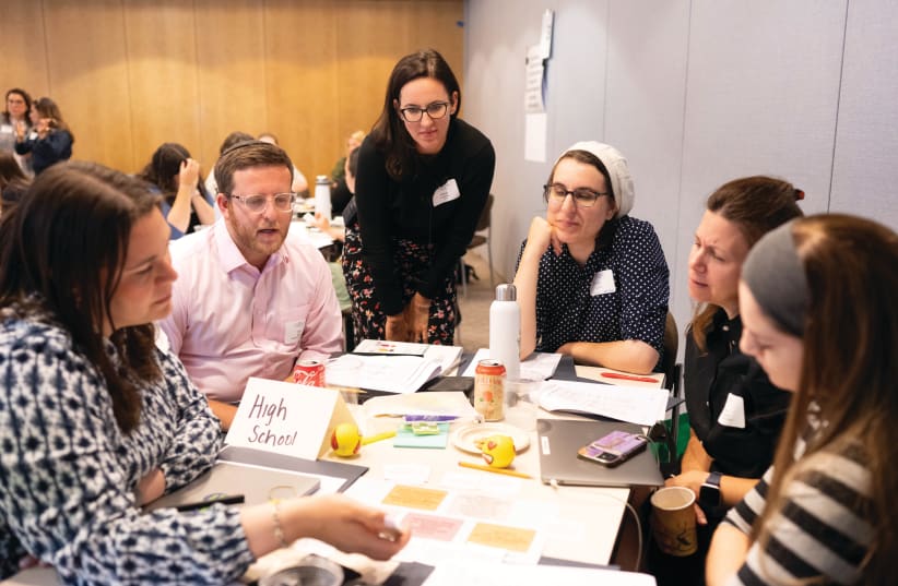  HIGH SCHOOL mentors discuss best practices for providing feedback to novice classroom teachers, at a JNTP Teacher Induction Program professional development session in New York City.  (photo credit: JNTP)