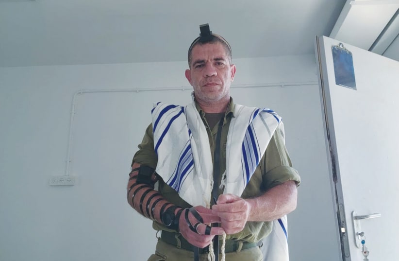  YARON AVRAHAM wearing his IDF uniform and tefillin. (photo credit: Courtesy)