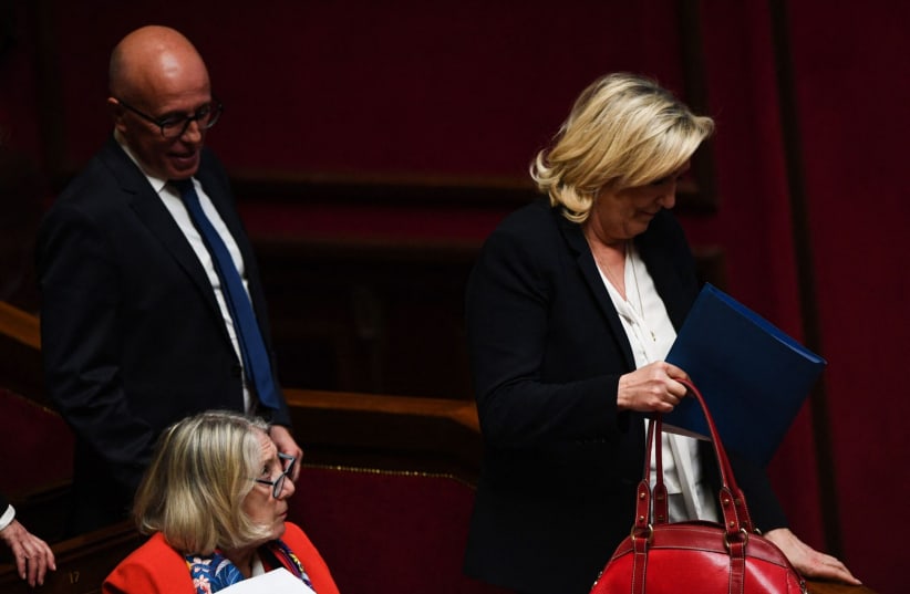 President of the French conservative party Les Republicains and member of Parliament Eric Ciotti and far-right National Rally president Marine Le Pen attend a session of the National Assembly in Paris, April 4, 2023. (photo credit: Christophe Archambault / AFP via Getty Images)