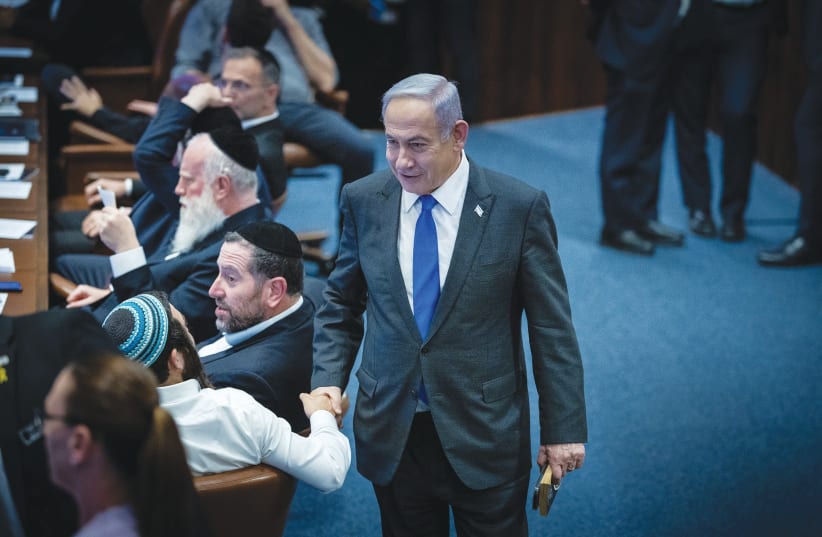  PRIME MINISTER Benjamin Netanyahu attends the debate and vote on legislation regarding haredi enlistment in the military, in the Knesset plenum, last week.  (photo credit: YONATAN SINDEL/FLASH90)