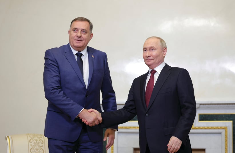  RUSSIA’S PRESIDENT Vladimir Putin shakes hands with Republika Srpska President Milorad Dodik during a meeting on the sidelines of the St. Petersburg International Economic Forum earlier this month. (photo credit: ANTON VAGANOV/ REUTERS)