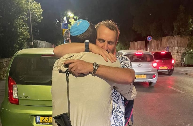  Rabbi Shmuley Boteach hugs a loved one who is serving the State of Israel as a member of the IDF. (photo credit: SHMULEY BOTEACH)