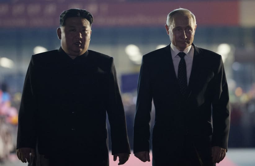  Russia's President Vladimir Putin and North Korea's leader Kim Jong Un attend a farewell ceremony before Putin's departure at an airport in Pyongyang, North Korea June 19, 2024. (photo credit: SPUTNIK/GAVRIIL GRIGOROV/POOL VIA REUTERS)