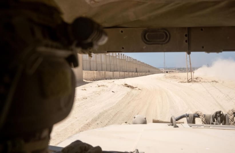   The Egyptian border on the Palestinian side in Gaza, to the left, as seen from the inside of an IDF jeep. (photo credit: IDF)