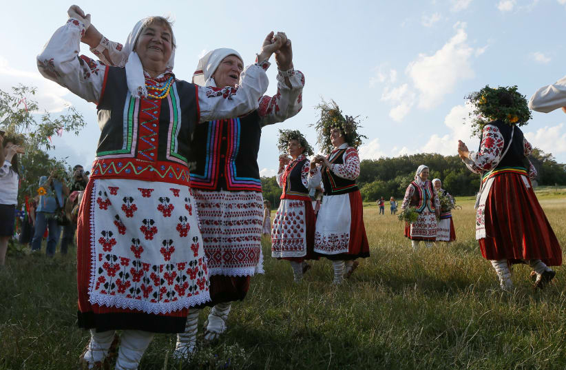  People take part in a celebration on the traditional Ivana Kupala (Ivan the Bather) holiday in Kiev, Ukraine July 6, 2018. (photo credit: REUTERS/VALENTYN OGIRENKO)