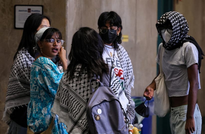 Pro-Palestinian student protesters who had been arrested for occupying and barricading a building at Columbia University react following a hearing, where criminal charges against them had been dropped, at the Manhattan Criminal Courthouse in New York City, U.S., June 20, 2024. (photo credit: REUTERS/BRENDAN MCDERMID)