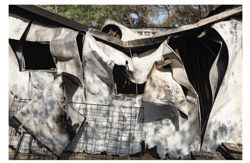 A house burns down in Kibbutz Nir Oz on October 7, 2023. (photo credit: COURTESY MIKI KRATSMAN)