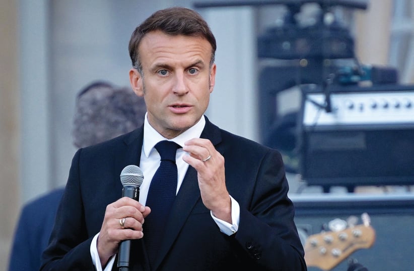 FRANCE’S PRESIDENT Emmanuel Macron speaks during a music festival in the courtyard of the Élysée presidential palace in Paris, on Friday. Macron has opened a Pandora’s box that leaves French citizens disoriented, worried, and angry, says the writer.  (photo credit: Bertrand Guay/Reuters)