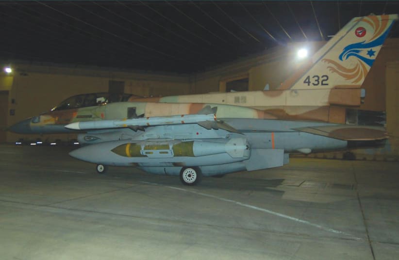  AN ISRAEL Air Force F-16I with a BLU-109 penetrating bunker-buster bomb under its wing; the bomb is wrapped with a JDAM kit. (photo credit: IDF Spokesperson’s Unit)