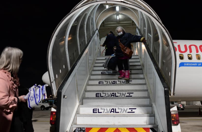  Jewish immigrants fleeing the war in Ukraine, on a rescue flight sponosred by Keren Hayesod, arrive at Ben Gurion airport near Tel Aviv on March 9, 2022. (photo credit: TOMER NEUBERG/FLASH90)