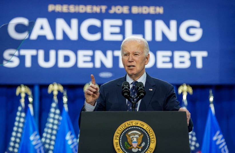  U.S. President Joe Biden speaks as he announces a new plan for federal student loan relief during a visit to Madison Area Technical College Truax Campus, in Madison, Wisconsin, U.S, April 8, 2024. (photo credit: REUTERS/KEVIN LAMARQUE)