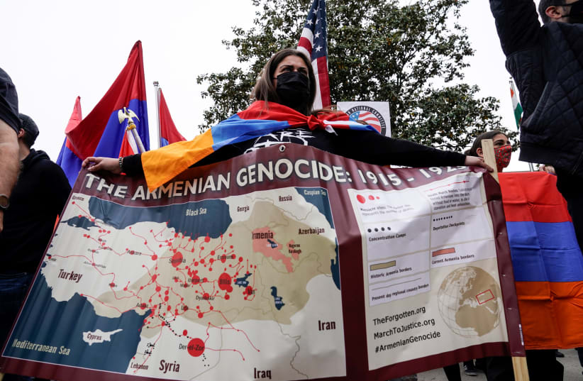  Members of the Armenian diaspora rally in front of the Turkish Embassy after U.S. President Joe Biden recognized that the 1915 massacres of Armenians in the Ottoman Empire constituted genocide in Washington, U.S., April 24, 2021.  (photo credit:  REUTERS/Joshua Roberts)