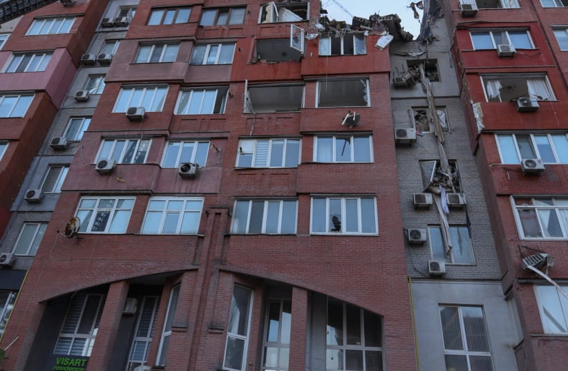 A firefighter works at a site of an apartment building hit by a Russian missile strike, amid Russia's attack on Ukraine, in Dnipro, Ukraine June 28, 2024. (photo credit: REUTERS/MYKOLA SYNELNYKOV)