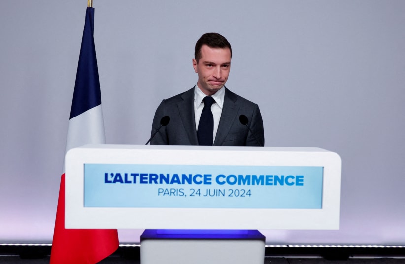   Jordan Bardella, President of the French far-right National Rally (Rassemblement National - RN) party, reacts as he attends a press conference to present policy priorities as part of the campaign for the upcoming French parliamentary elections, in Paris, France, June 24, 2024. (photo credit: REUTERS/GONZALO FUENTES/FILE PHOTO)