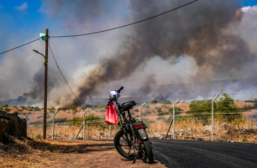  Smoke and fire rise from a fire which broke out from missiles fired from Lebanon, outside Kibbutz Shamir, northern Israel, August 15, 2024 (photo credit: AYAL MARGOLIN/FLASH90)