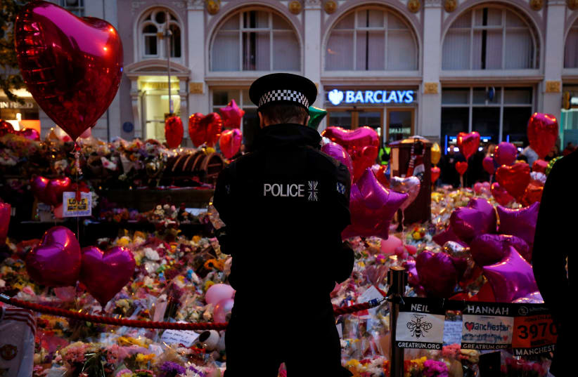 People attend a vigil for the victims of last week's attack at a pop concert at Manchester Arena, in central Manchester, Britain May 29, 2017.  (photo credit: ANDREW YATES/REUTERS)