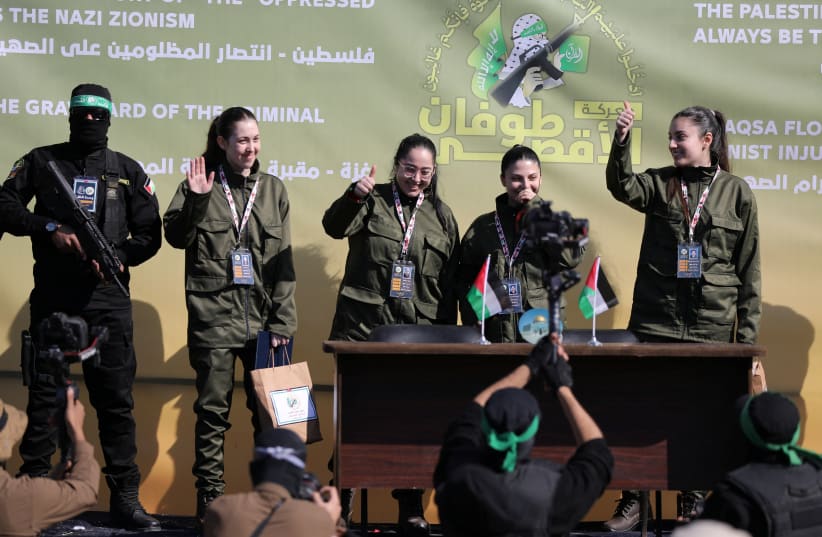 Four female Israeli soldiers, who had been held in Gaza since the deadly October 7, 2023 attack, are released by Hamas militants as part of a ceasefire and a hostages-prisoners swap deal between Hamas and Israel, in Gaza City, January 25, 2025. (photo credit: Dawoud Abu Alkas/Reuters)