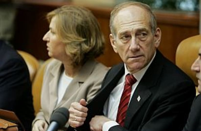 olmert reaches in pocket (photo credit: AP)