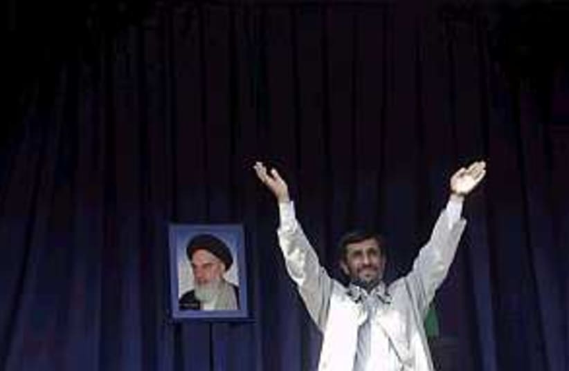 Ahmadinejad hands 298.88 (photo credit: AP)