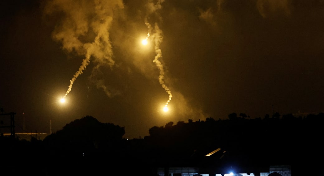  Flares, fired from the Israeli side, burn in the sky as seen from Ramyah near the Lebanese-Israeli border, in southern Lebanon, October 11, 2023 (photo credit: REUTERS/THAIER AL-SUDANI)