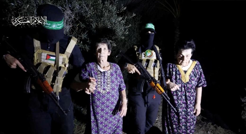 Yocheved Lifshitz and Nurit Cooper (also known as Nurit Yitzhak) who were held hostages by Palestinian Hamas terrorists, are released by them, in this video screengrab obtained by Reuters on October 23, 2023. (photo credit: Al-Qassam Brigades via REUTERS)