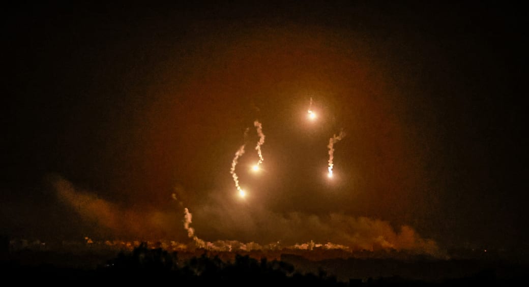  Flares burn in the sky as seen from the Israeli side of the border with Gaza, in southern Israel, November 7, 2023. (photo credit: AMMAR AWAD/REUTERS)