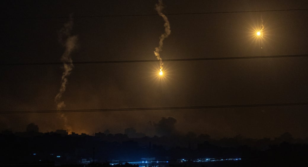  Flares burn in the sky as seen from the Israeli side of the border with Gaza, in southern Israel, November 9, 2023. (photo credit: EVELYN HOCKSTEIN/REUTERS)