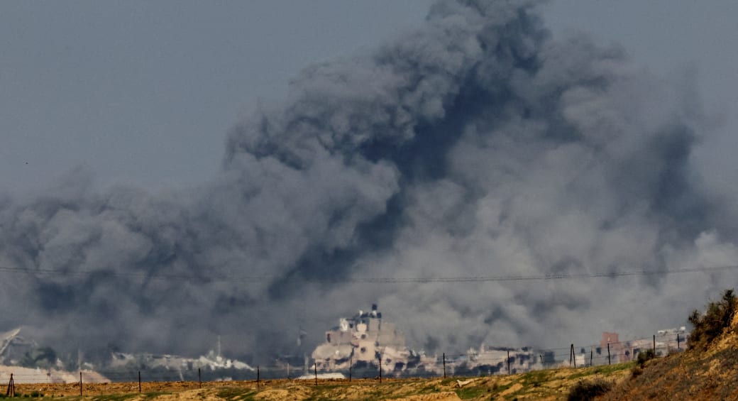  Smoke rises among buildings destroyed in IDF airstrikes, amid the ongoing war between Israel and Hamas, at the Israel-Gaza border as seen from southern Israel, December 6, 2023. (photo credit: REUTERS/ATHIT PERAWONGMETHA)