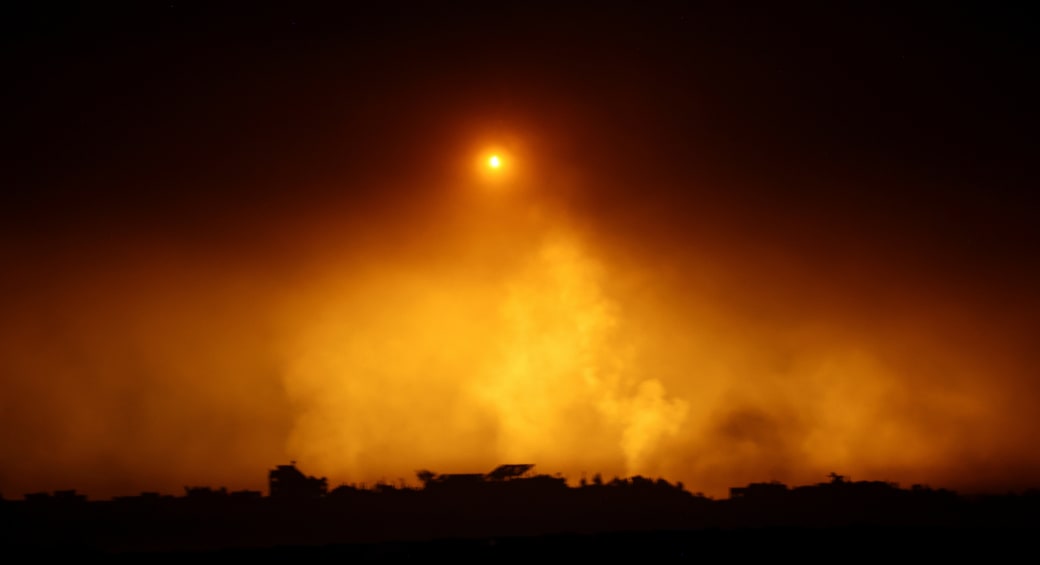  A flare falls over Gaza, amid the ongoing conflict between Israel and the Palestinian Islamist group Hamas, as seen from southern Israel, December 7, 2023. (photo credit: ATHIT PERAWONGMETHA / REUTERS)