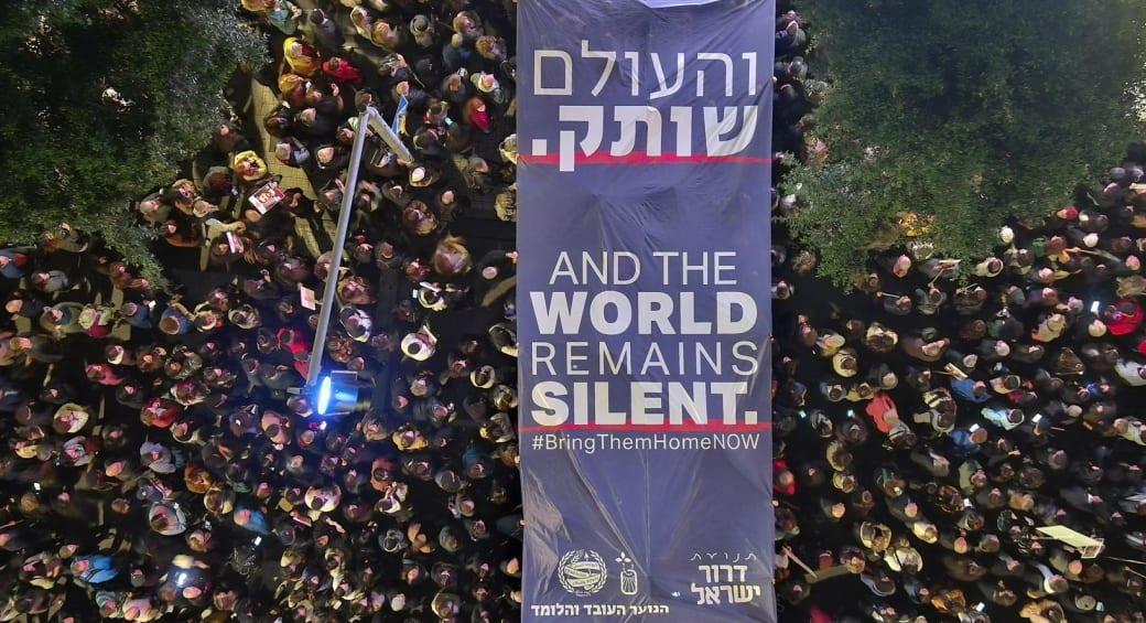  A banner held up by protesters at a protest marking 100 days since the October 7 massacre. (photo credit: Marcelo Shneidman)