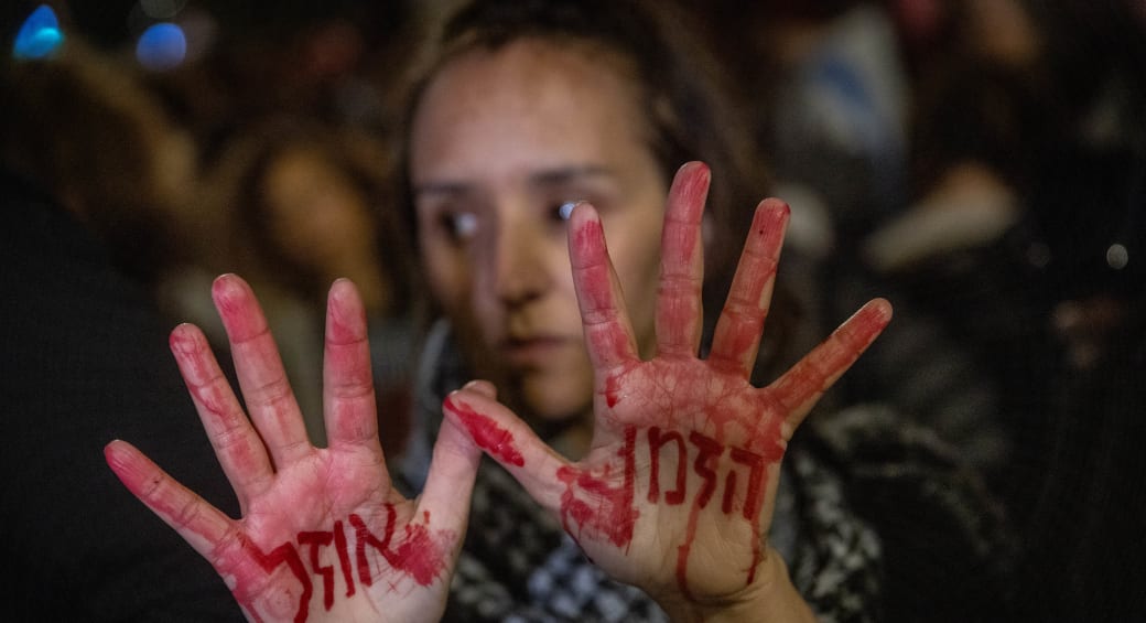  A WOMAN attends a protest in Jerusalem this week calling for the release of Israeli hostages held by Hamas in Gaza. The words on her hands read: ‘Time is running out.’ (photo credit: FLASH90/CHAIM GOLDBERG)