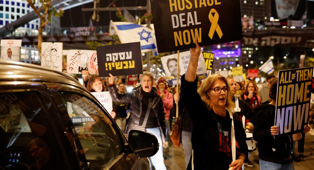  Demonstrators take part in a protest calling for the release of hostages, in Tel Aviv (photo credit: REUTERS/CARLOS GARCIA RAWLINS)