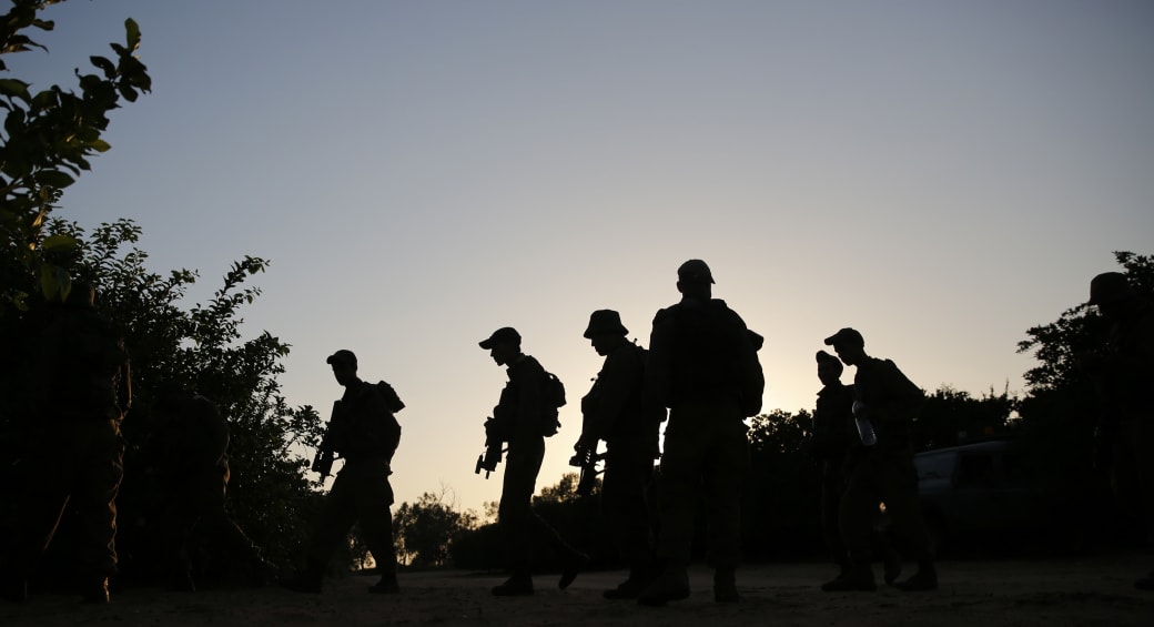  Bedouin Arab Israeli Defense Force soldiers take part in a night-time tracking drill near Tze'elim in southern Israel June 9, 2014. (photo credit: FINBARR O'REILLY / REUTERS)