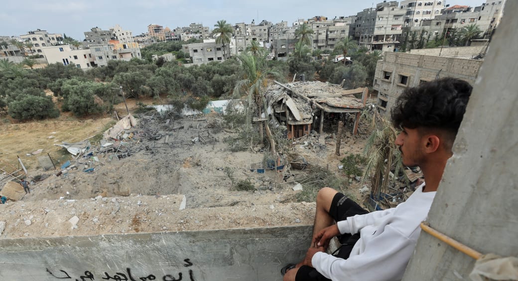  A Palestinian man views the site of an Israeli strike on a house, in the central Gaza Strip, June 3, 2024 (photo credit: REUTERS/Ramadan Abed)