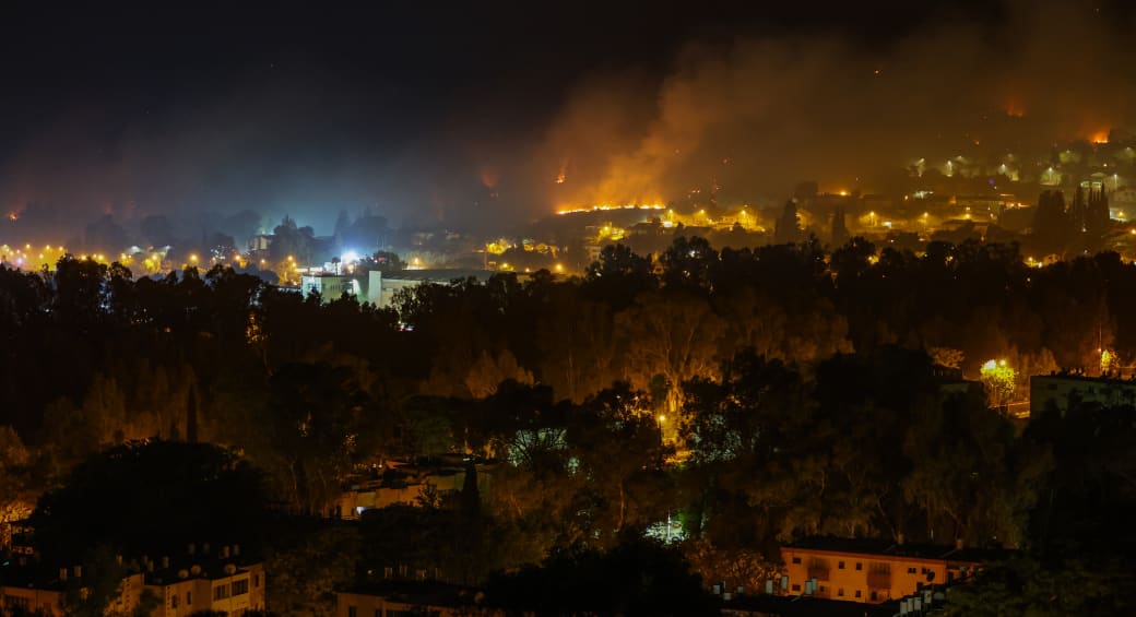 View of a large fire caused from rockets fired from Lebanon, in the northern Israeli town of Kiryat Shmona, June 3, 2024 (photo credit: David Cohen/Flash90)