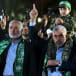 The son of senior Hamas terrorist Mazen Fuqaha sits on the shoulders of Hamas Gaza chief Yahya Sinwar