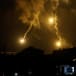  Flares, fired from the Israeli side, burn in the sky as seen from Ramyah near the Lebanese-Israeli border, in southern Lebanon, October 11, 2023