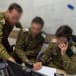  IDF soldiers are seen working as part of the Israeli military's Gaza battlefield intelligence collection unit.