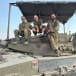  Soldiers show damage to tank from an explosive charge - Gaza