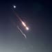  Objects are seen in the sky above Jerusalem after Iran launched drones and missiles towards Israel, in Jerusalem April 14, 2024.