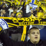 Fans of Beitar Jerusalem shout slogans during a match against Bnei Sakhnin as part of the Israeli Premier League