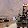 Hezbollah and Syrian flags flutter on a military vehicle in Western Qalamoun, Syria August 28, 2017.