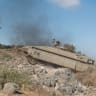 A Namer APC shows off its abilities traversing steep terrain